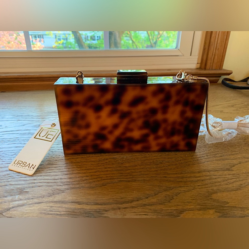 7.5” x 4.5” brown and black urban expressions vegan clutch